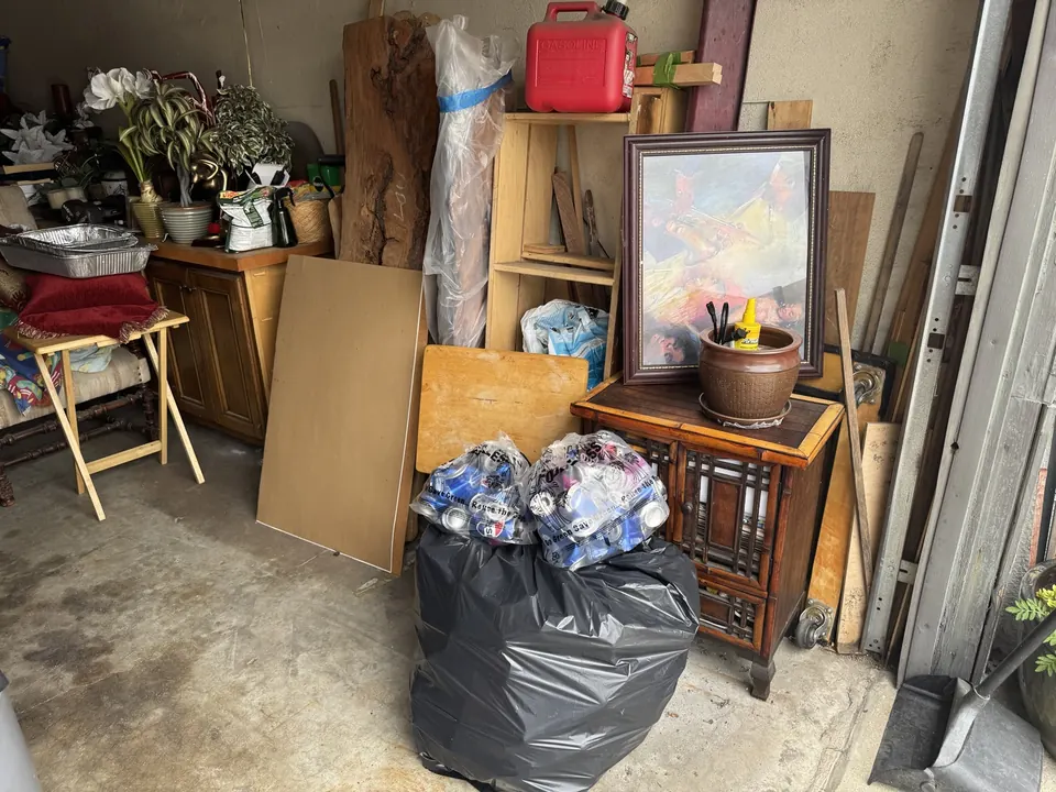 Garage furniture and household belongings; visible fuel can and chemicals are excluded, and not every pictured item is accepted