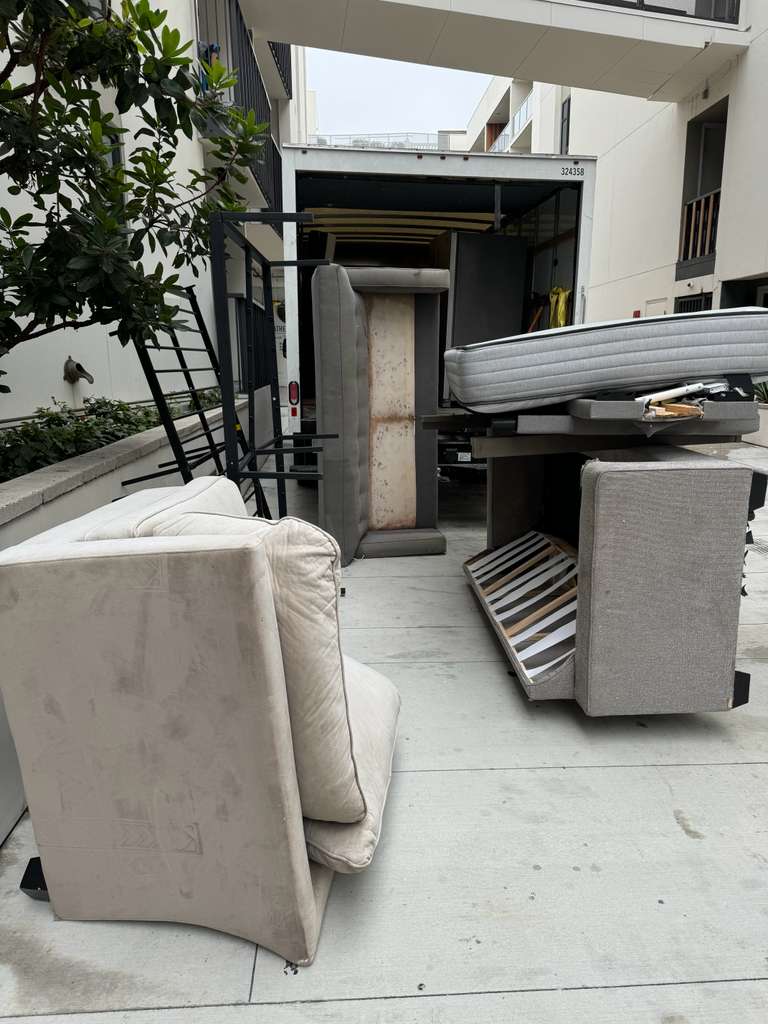 Real Baka Junk Removal job — apartment move-out loadout with mattresses, couches, and our box truck in Los Angeles