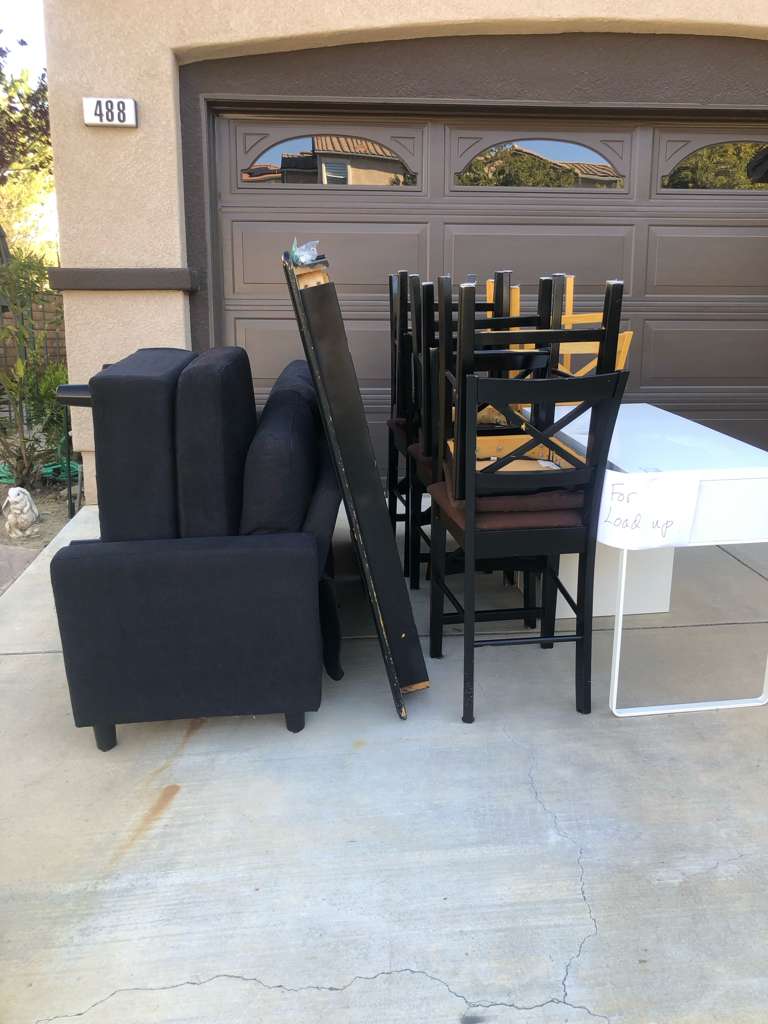 Baka crew job — curbside furniture pickup in a Los Angeles driveway, junk removal Los Angeles