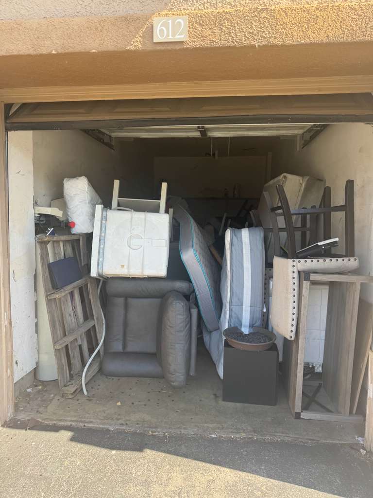 Storage garage full of household items before cleanout — junk removal Los Angeles