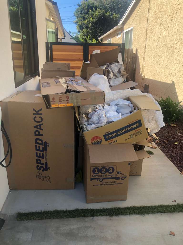 Pile of moving boxes and packing paper hauled away — junk removal Los Angeles